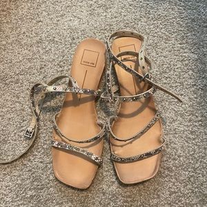 Dolce Vita wrap around the ankle flat snake skin studded sandals.